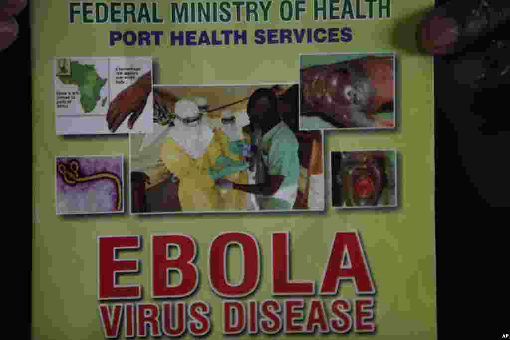 Nigeria health officials display a leaflet explaining the Ebola virus, at the arrival hall of Murtala Muhammed International Airport, in Lagos, Nigeria, Aug. 4, 2014.&nbsp;