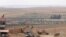 FILE - U.S. forces set up a new base in Manbij, Syria, May 8, 2018. 