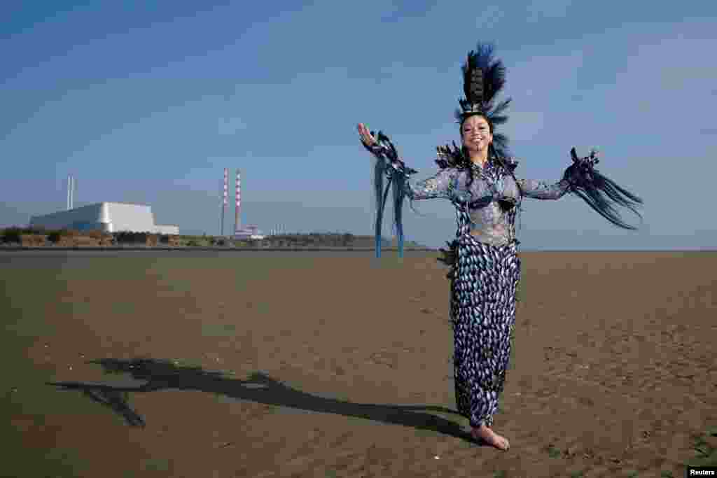 Winner of Junk Kouture world designer of the year Clodagh Ramsey, 17, from Wilso&#39;s Hospital School in County Westmeath, poses in her dress called &#39;Aquacultural,&#39; an organic waste design she made from around 2,000 mussel shells championing sustainable food production,&nbsp;on Sandymount beach, in Dublin, Ireland.