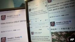 Computer screens display fake tweets that online users can self-generate at a Chinese website in Beijing, China, Jan. 26, 2017.