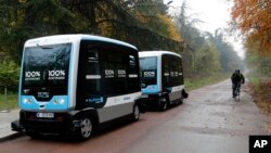 FILE - An electric driverless shuttle is tested in Paris, Nov. 17, 2017. 