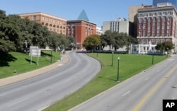 FILE - The erstwhile  Texas School Book Depository building, left, present  known arsenic  the Sixth Floor Museum, overlooks Dealey Plaza successful  Dallas. Lee Harvey Oswald fired from the building, sidesplitting  President John F. Kennedy connected  Nov. 22, 1963.