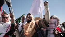 FILE - Sudanese demonstrators attend a rally to demand the return to civilian rule a year after a military coup, in Khartoum, Sudan, Nov. 17, 2022.