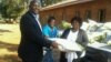 Okay Machisa presenting blankets and other goods at Northcot Training Institute. (Photo/Irwin Chifera)