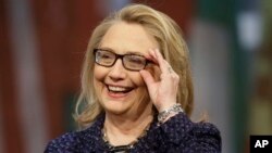 Secretary of State Hillary Rodham Clinton adjusts her glasses during a 'Global Townterview' at the Newseum, Washington, Jan. 29, 2013.