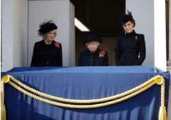 Britain's Queen Elizabeth II, Kate, Duchess of Cambridge, right, and Camilla, Duchess of Cornwall, attend the Remembrance Sunday ceremony at the Cenotaph in Whitehall in London, Nov. 10, 2019.