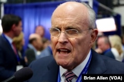 Former New York City Mayor Rudy Giuliani, a supporter of Republican presidential nominee Donald Trump, speaks to reporters after the debate, in an area known as Spin Alley, at Hofstra University in Hempstead, N.Y., Sept. 26, 2016.