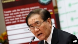 Public Health Minister Rajata Rajatanavin talks to reporters during press conference in Bangkok, Thailand, June 18, 2015.