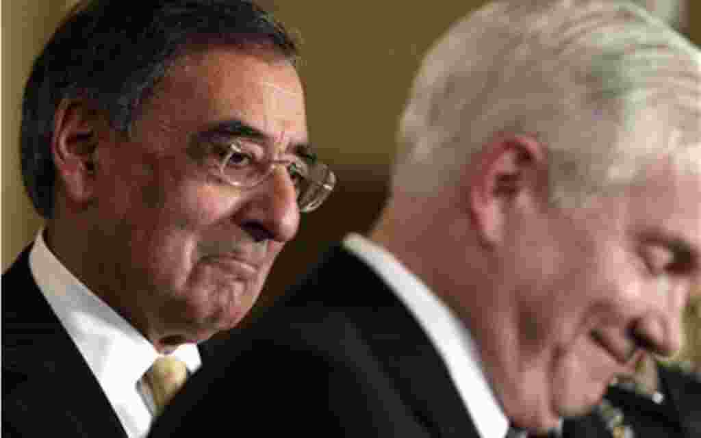 Defense Secretary nominee Leon Panetta, left, listens as outgoing Defense Secretary Robert Gates, speaks during a news conference in the East Room of the White House, Thursday, April 28, 2011, in Washington. (AP Photo/Carolyn Kaster)