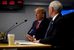 President Donald Trump attends a teleconference with governors to discuss partnerships to "prepare, mitigate and respond to COVID-19" at the headquarters of the Federal Emergency Management Agency in Washington, March 19, 2020.
