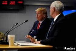 President Donald Trump attends a teleconference with governors to discuss partnerships to "prepare, mitigate and respond to COVID-19" at the headquarters of the Federal Emergency Management Agency in Washington, March 19, 2020.