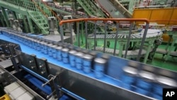 FILE - The beer production line is seen at an Asahi Breweries factory in Moriya near Tokyo, May 29, 2017.