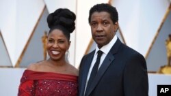 Pauletta Washington, left, and Denzel Washington arrive at the Oscars, Feb. 26, 2017, at the Dolby Theatre in Los Angeles. 