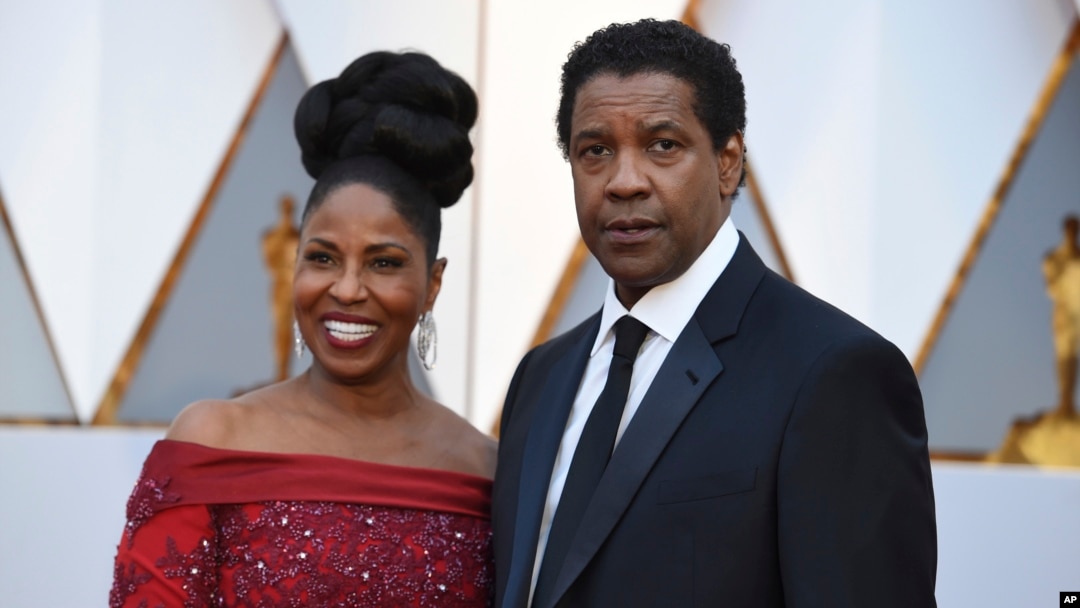 Pauletta Washington, left, and Denzel Washington arrive at the Oscars, Feb. 26, 2017, at the Dolby Theatre in Los Angeles. 