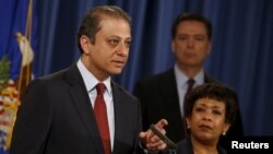 Manhattan U.S. Attorney Preet Bharara (L-R), Federal Bureau of Investigation Director James Comey and U.S. Attorney General Loretta Lynch hold a news conference to announce indictments on Iranian hackers for a coordinated campaign of cyber attacks in 2012