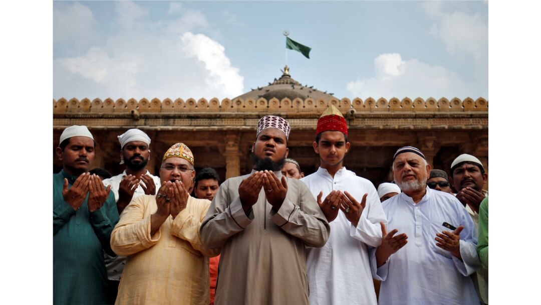 FILE - Muslims pray for peace ahead of the India Supreme Court verdict on a disputed religious site in Ayodhya, inside a mosque premises in Ahmedabad, India, Nov. 8, 2019.
