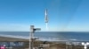 In this screen grab taken from the SpaceX broadcast the Starship's Super Heavy Booster returns to the launch pad at Starbase near Boca Chica, Texas, on Jan. 16, 2025. 