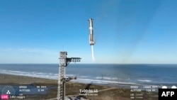 In this screen grab taken from the SpaceX broadcast the Starship's Super Heavy Booster returns to the launch pad at Starbase near Boca Chica, Texas, on Jan. 16, 2025. 