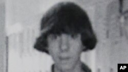 This undated photo shows Adam Lanza posing for a group photo of the technology club which appeared in the Newtown High School yearbook.