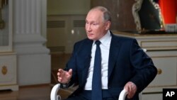 Russian President Vladimir Putin speaks to NBC News journalist Keir Simmons in an interview that aired June 14, 2021, two days before the Russian leader is to meet U.S. President Joe Biden in Geneva. (Maxim Blinov, Sputnik, Kremlin Pool Photo via AP)