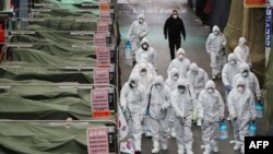 23일 신종 코로나바이러스 확산 사태로 문을 닫은 한국 대구의 한 시장에서 방역 요원들이 소독제를 살포하고 있다.