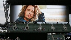 A tribute to singer Chris Cornell is shown on a video display at Safeco Field in Seattle before a baseball game between the Seattle Mariners and the Chicago White Sox, May 18, 2017. Cornell, who was born and raised in Seattle and was part of the group of artists who formed the grunge scene, died May 17, 2017, in Detroit. 