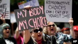 A group gathers to protest abortion restrictions at the State Capitol in Austin, Texas, May 21, 2019.