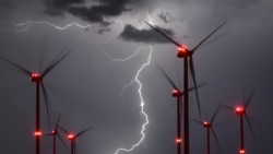 In this Aug. 1, 2017 photo lightning illuminate the night sky over the Odervorland wind farm in the Oder-Spree district near to Sieversdorf, Germany. (Patrick Pleul/dpa via AP)