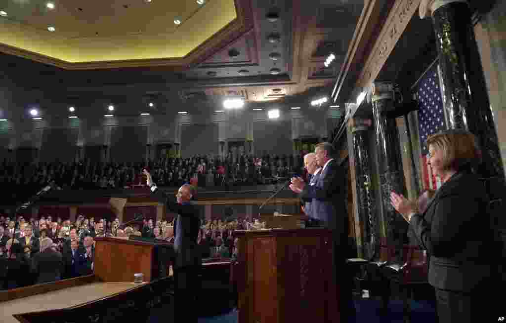 President Barack Obama waves as he arrives to deliver his State of the Union address to a joint session of Congress on Capitol Hill, Jan. 20, 2015.