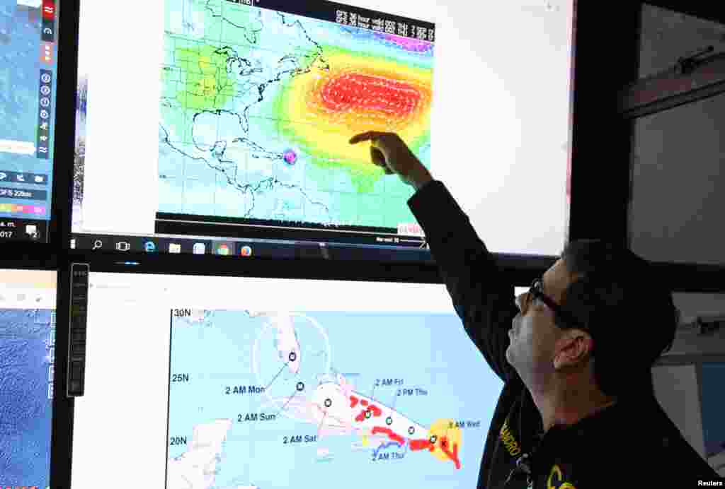 A member of the Emergency Operations Committee (COE) monitors the trajectory of Hurricane Irma in Santo Domingo, Dominican Republic, Sept. 6, 2017.