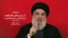 A photo taken from Hezbollah's Al-Manar TV video shows the Lebanese militant group's chief, Hassan Nasrallah, addressing the nation from an undisclosed location on Sept. 19, 2024.