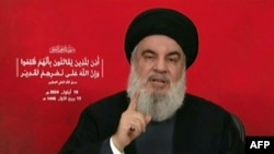 FILE - An image grab taken from Hezbollah's Al-Manar TV shows the Lebanese militant group's chief Hassan Nasrallah addressing the nation from an undisclosed location on Sept. 19, 2024.