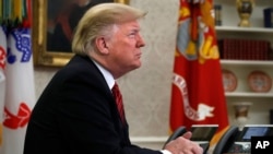 FILE - President Donald Trump in the Oval Office of the White House, Dec. 25, 2018.