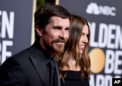 Christian Bale, left, and Sibi Blazic arrives at the 76th annual Golden Globe Awards