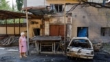 A woman walks at a site of a recent shelling, which local Russian-installed authorities called a Ukrainian military strike, in the course of Russia-Ukraine conflict in Donetsk, Russian-controlled Ukraine, July 22, 2024. 