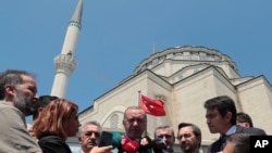 Turkish President Recep Tayyip Erdogan speaks to the media after Friday prayers, in Istanbul, June 7, 2019. 