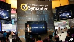 FILE - In this April 22, 2015 file photo, a presentation is made in the Symantec booth during the RSA Conference in San Francisco. 