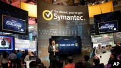 FILE - In this April 22, 2015 file photo, a presentation is made in the Symantec booth during the RSA Conference in San Francisco. 