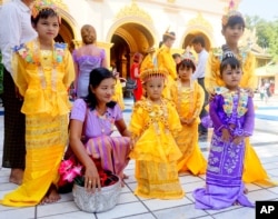 FILE - A traditional Burmese religious ceremony takes place in the Mahamuni Monastery in Mandalay, Myanmar, Nov. 4, 2017.