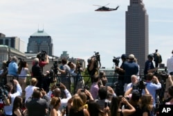 A helicopter carrying Republican presidential candidate Donald Trump flies near the site of the Republican National Convention, in Cleveland, July 20, 2016.