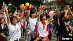 Participants take part in a flash mob during a lesbian, gay, bisexual, and transgender (LGBT) event on a street in Hanoi, Oct. 27, 2013.