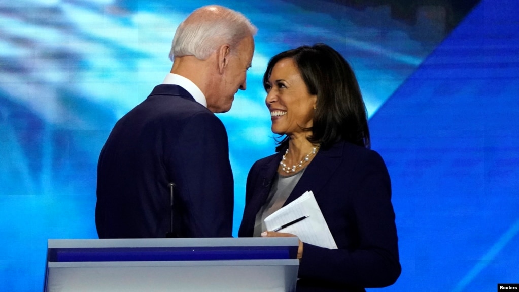 FILE - Former Vice President Joe Biden talks with Senator Kamala Harris after the conclusion of the 2020 Democratic U.S. presidential debate in Houston, Texas, U.S., September 12, 2019. (REUTERS/Mike Blake/File Photo)