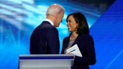 FILE PHOTO: Former Vice President Joe Biden talks with Senator Kamala Harris after the conclusion of the 2020 Democratic U.S. presidential debate in Houston, Texas, U.S., September 12, 2019. REUTERS/Mike Blake/File Photo