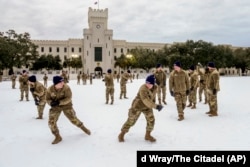 Cadets at the Citadel military college throw snowballs at each other during a rare snow day on their campus in Charleston, South Carolina, Jan. 22, 2025. (Ed Wray/The Citadel via AP)