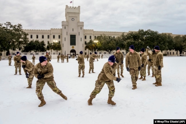 Cadets at the Citadel military college throw snowballs at each other during a rare snow day on their campus in Charleston, South Carolina, Jan. 22, 2025. (Ed Wray/The Citadel via AP)