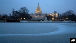 The Capitol is seen with the Reflecting Pool covered in ice and snow, in Washington, Feb. 1, 2019. U.S. lawmakers are expected to vote on a deal to provide money for border security and avert a government shutdown.