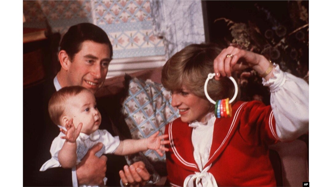 FILE - Princess Diana and Prince Charles are shown with their son Prince William during a photo session at Kensington Palace in London in December 1982.
