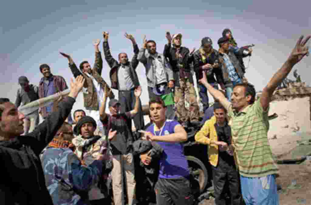 Libyan rebels jubilate after taking the city of Ajdabiya, south of Benghazi, eastern Libya, Saturday, March 26, 2011