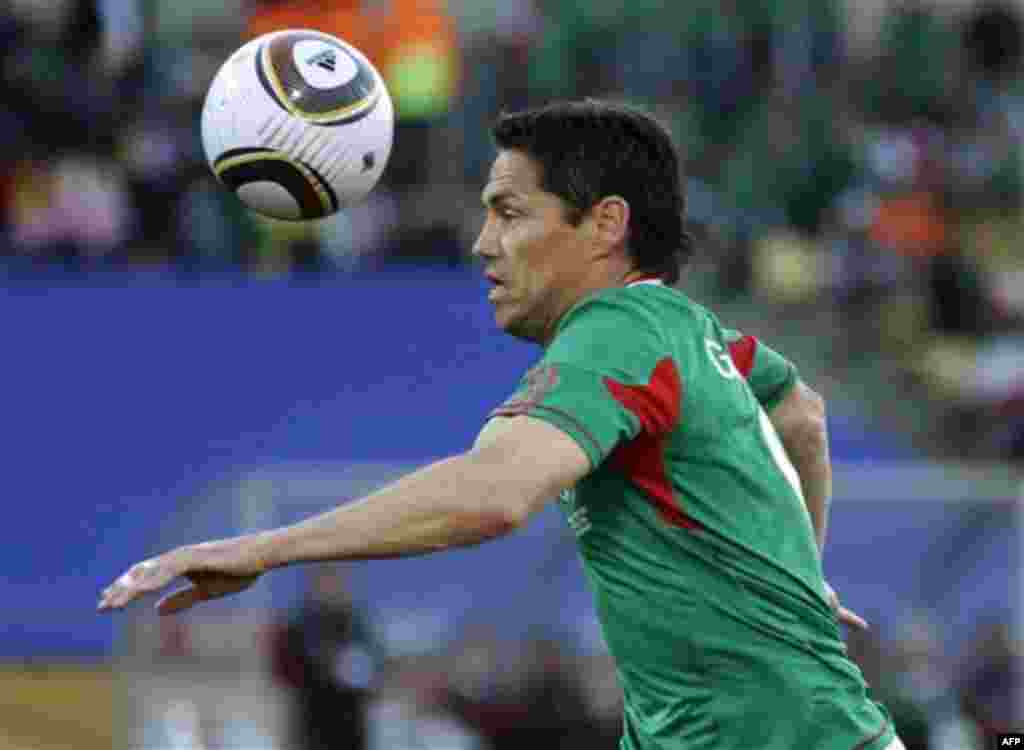 Mexico's Guillermo Franco heads the ball during the World Cup group A soccer match between Mexico and Uruguay at Royal Bafokeng Stadium in Rustenburg, South Africa, on Tuesday, June 22, 2010. (AP Photo/Guillermo Arias)