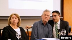 Gorel Biniel (L) and Dag Gustafsson (C), parents of Swedish software developer Ola Bini, and lawyer Carlos Soria, hold a news conference after a local judge ordered Bini jailed pending trial for alleged role in hacking government computers, in Quito, Ecuador, April 16, 2019.